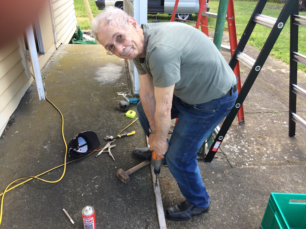 Lee, drilling holes in the cross brace
