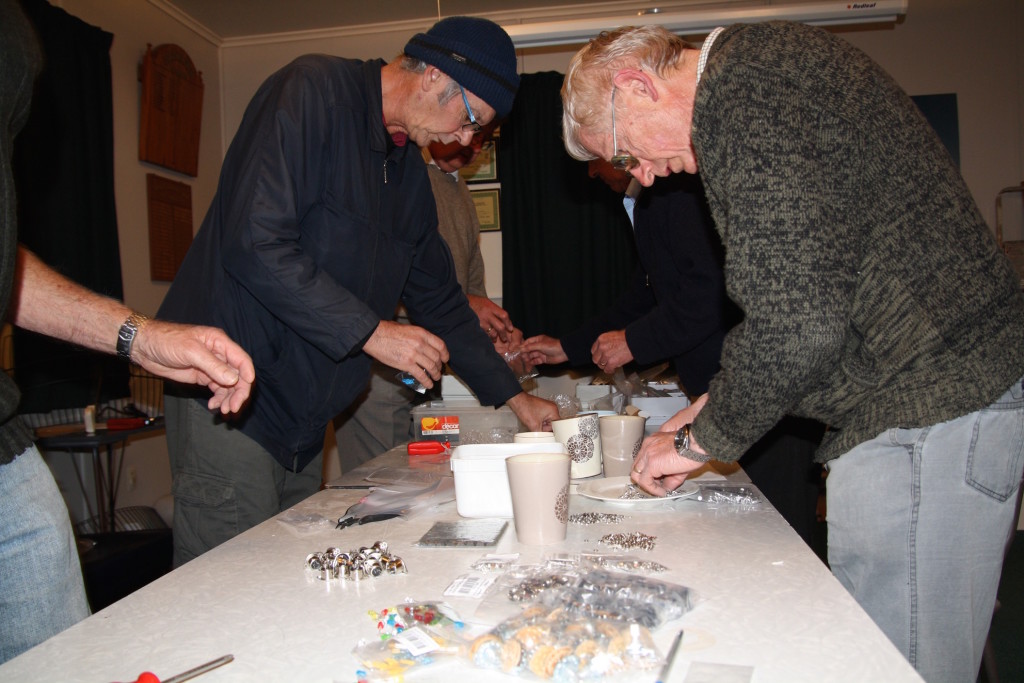 Many hands make light work counting out the hundreds of screws, nuts, washers and parts.